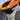 Back view of person loading a kayak onto car roof wearing Campfire Nights long sleeve tee with mountain and campfire graphic, outdoor adventure and camping apparel