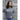 Front view of woman wearing unisex Saltery Cove Thin Hoodie in heather gray, modeled outdoors, showcasing comfortable island life apparel style.