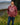 Man wearing maroon Adventure in Every Letter hoodie from the Wake Up. Rock Life. Repeat. Collection, standing by the water with mountains in the background—nature-inspired hoodie for outdoor adventures and travel