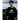 Boy wearing black Rock Life Kodiak Alaska youth crewneck sweatshirt with white bear logo by rocky ocean shore – Alaska-themed and island life apparel